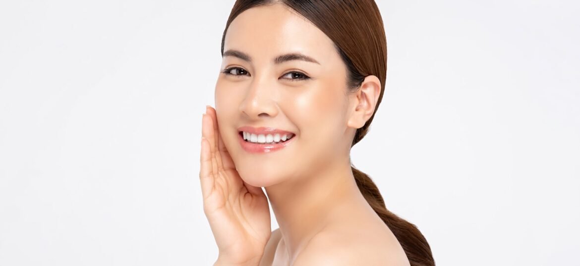 asian-woman-smiling-with-hand-touching-face-beauty-skin-care-concepts asian-woman-smiling-with-hand-touching-face-beauty-skin-care-concepts
